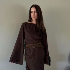 @annabelrosendahl wearing a brown NAKD boatneck long-sleeve maxi dress with a belt.