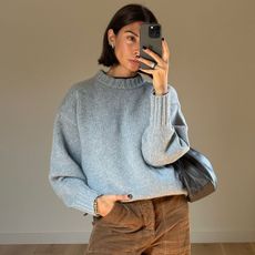 Woman in gray sweater